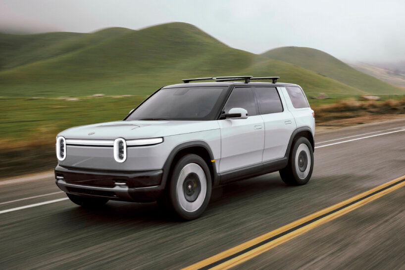 Rivian driving on the road.