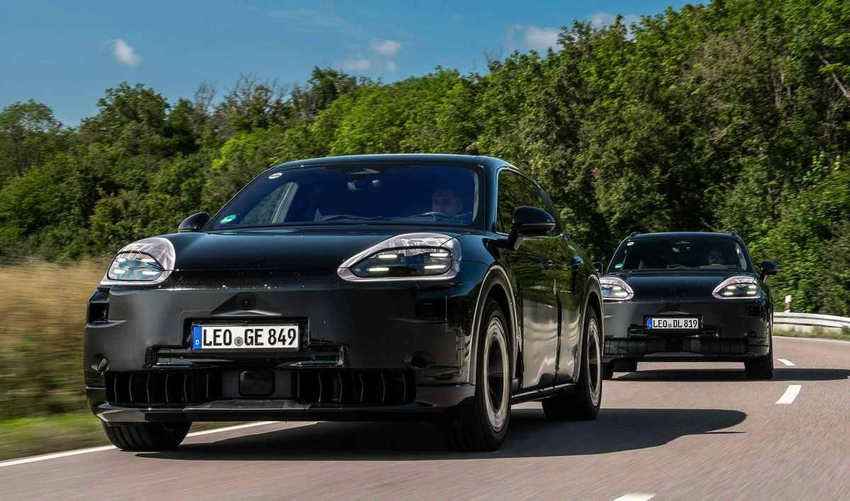 Black Porsche Cayenne EVs driving on the road.