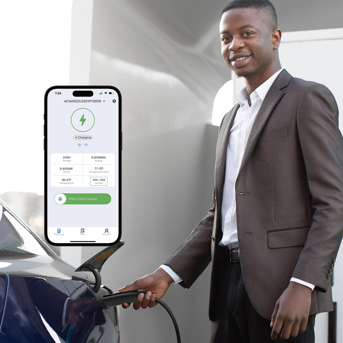 A male is inserting the NACS plug into the Model Y's charging port