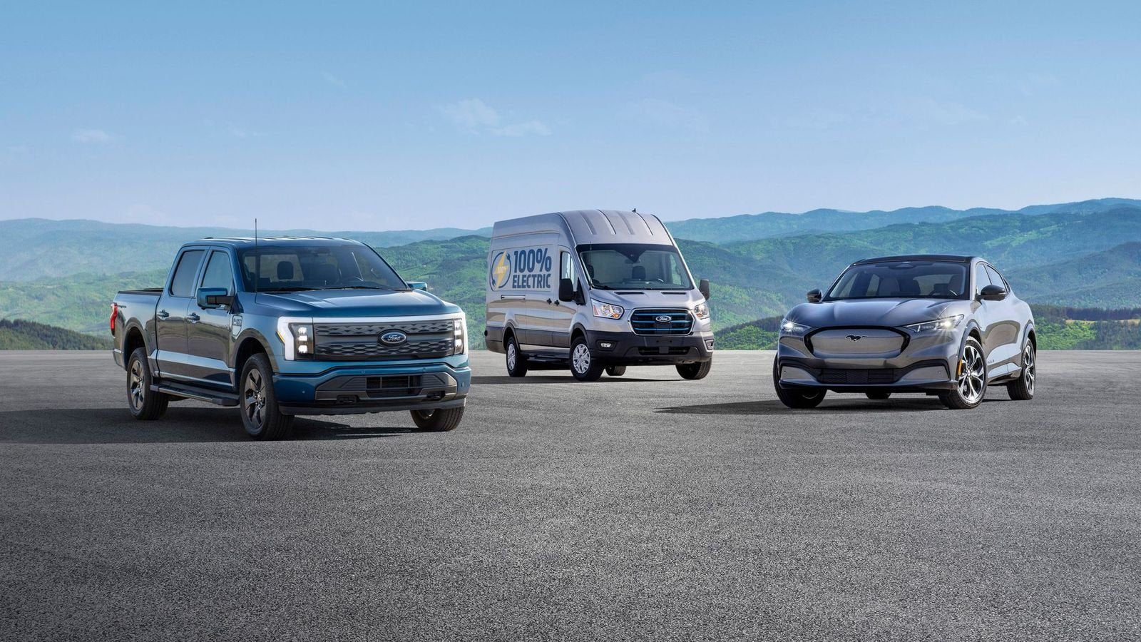 Three Ford electric vehicles, truck, van, and SUV, parked on a road.
