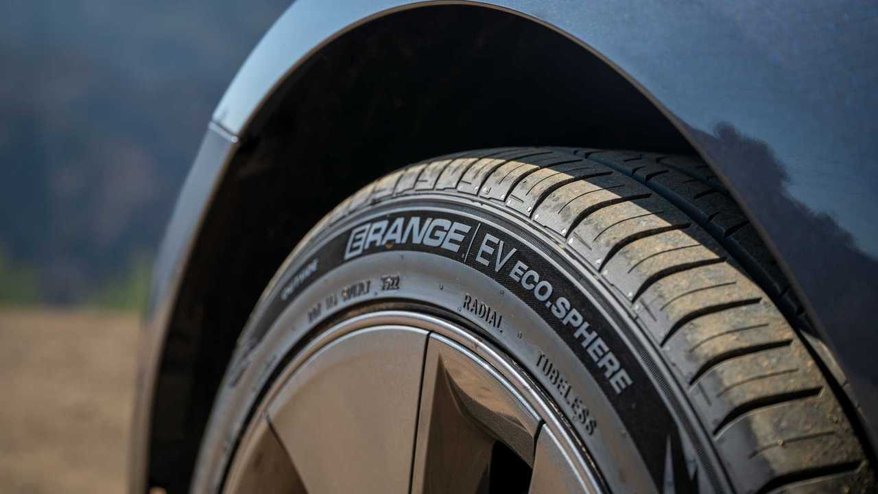 Close-up of ERange EV tire on a dark car.