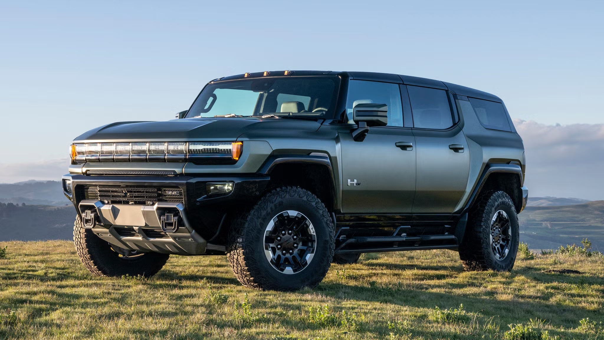 GMC Hummer EV on the grassland.