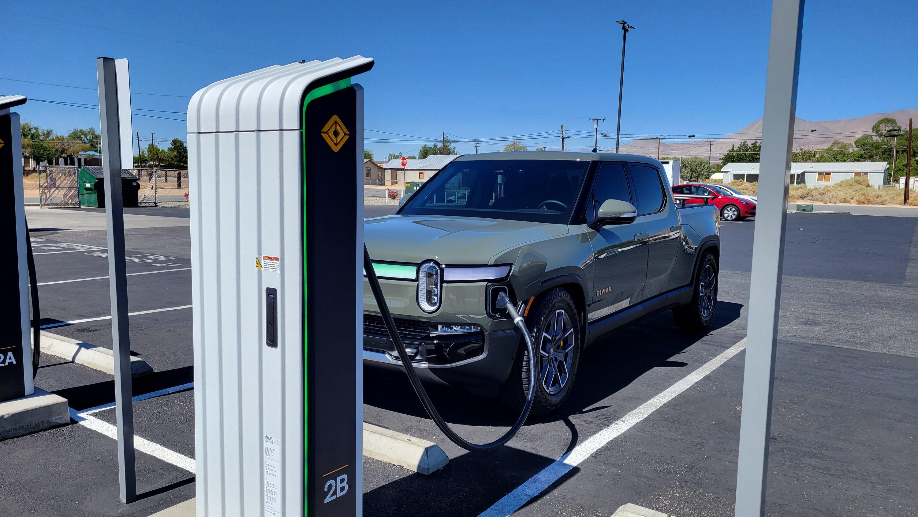 A Rivian vehicle charging with Rivian fast charger.