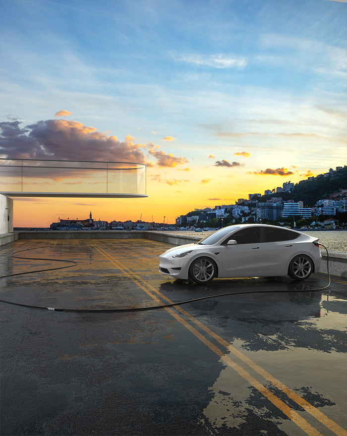 A Tesla being charged while parked away from a power source using the EVDANCE Tesla Extension Cord.