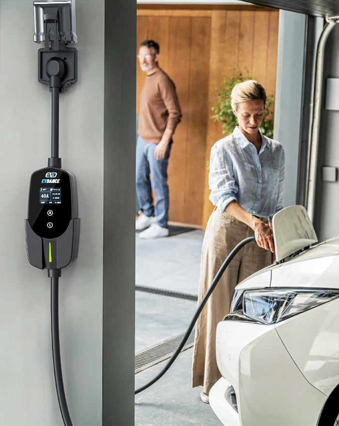 A EV owner is using an EVDANCE 40A portable charger at home to charge an EV with a J1772 interface