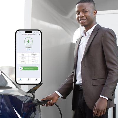 A male is inserting the NACS plug into the Model Y's charging port